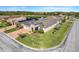 An aerial view of a single Gathering home showing a lake and several solar panels in the neighborhood at 428 Bel Air Way, Kissimmee, FL 34759