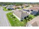 Aerial view of a lovely home with well-manicured lawn, landscaping and solar panels at 428 Bel Air Way, Kissimmee, FL 34759
