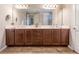 Elegant bathroom featuring a double vanity with a large mirror and fixtures at 428 Bel Air Way, Kissimmee, FL 34759