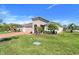 Charming home featuring a two-car garage, brick driveway, and a neatly landscaped front yard at 428 Bel Air Way, Kissimmee, FL 34759
