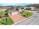 Beautiful single Gathering home with a two car garage, brick driveway, and well-maintained lawn at 428 Bel Air Way, Kissimmee, FL 34759