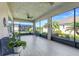 Relaxing screened lanai with ceiling fans, tile flooring and beautiful backyard views at 428 Bel Air Way, Kissimmee, FL 34759