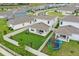 An aerial view of a residence featuring a fenced yard, outdoor patio, and surrounding community at 4338 Davos Dr, Clermont, FL 34711