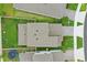Aerial view of a home showcasing the roof, backyard, and surrounding neighborhood at 4338 Davos Dr, Clermont, FL 34711