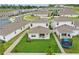 Overhead shot highlighting a fenced backyard, patio space, and the layout within a residential area at 4338 Davos Dr, Clermont, FL 34711