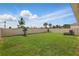 Spacious backyard featuring lush green grass and a privacy fence, perfect for outdoor activities at 4338 Davos Dr, Clermont, FL 34711
