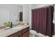 Bathroom featuring a vanity with a sink, decorative plants and a shower with stylish curtain at 4338 Davos Dr, Clermont, FL 34711