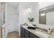 Stylish bathroom with double vanity, granite countertop, and a tiled shower at 4338 Davos Dr, Clermont, FL 34711