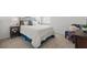 Bright bedroom featuring a comfortable bed with side tables and decorative accents, creating a relaxing retreat at 4338 Davos Dr, Clermont, FL 34711