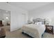 Cozy bedroom with a comfortable bed, side tables with lamps, and ample closet space at 4338 Davos Dr, Clermont, FL 34711