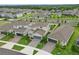 Beautiful homes featuring manicured lawns, brick driveways, and inviting curb appeal at 4338 Davos Dr, Clermont, FL 34711