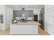 Modern kitchen with granite counters, stainless steel appliances and a large kitchen island at 4338 Davos Dr, Clermont, FL 34711