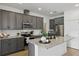 Contemporary kitchen with granite countertops, stainless steel appliances, and a functional kitchen island at 4338 Davos Dr, Clermont, FL 34711