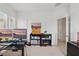 Bright office space with dual monitors, a sleek black desk, and plenty of natural light at 4338 Davos Dr, Clermont, FL 34711