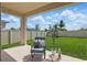 Inviting outdoor patio with comfortable seating, lush greenery, and a serene backyard view at 4338 Davos Dr, Clermont, FL 34711