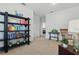 Cozy sitting area with comfortable seating and a stylish bookcase for a relaxing ambiance at 4338 Davos Dr, Clermont, FL 34711