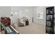 Comfortable sitting area featuring a cozy armchair, side table, and natural light from a window at 4338 Davos Dr, Clermont, FL 34711