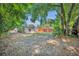 Spacious backyard featuring a shed, and a wood fence that offers ample room for outdoor activities at 440 E Crystal Lake St, Orlando, FL 32806