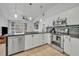 Well-appointed kitchen featuring modern stainless steel appliances, stylish countertops, and ample cabinet space at 440 E Crystal Lake St, Orlando, FL 32806