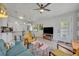Bright and airy living room featuring modern decor, tile flooring, and seamlessly integrated with the kitchen at 440 E Crystal Lake St, Orlando, FL 32806