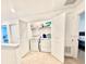 Convenient upstairs laundry closet featuring white appliances, storage shelving, and easy access to the bedrooms at 4520 Calvary Way, St Cloud, FL 34769