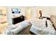 Large bedroom featuring a walk-in closet, a bathroom with double sinks and stand up shower, and carpet flooring at 4520 Calvary Way, St Cloud, FL 34769