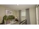 Cozy bedroom with a twin bed, nature-themed decor, and a large window for natural light at 4622 Snapdragon Pl, Lake Hamilton, FL 33851