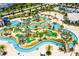 Aerial view of the community lazy river with lush landscaping and tropical palm trees at 4731 Clock Tower Dr # 104, Kissimmee, FL 34746