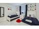 Playful bedroom with two twin beds, colorful Mickey Mouse decor, and a bright atmosphere at 4731 Clock Tower Dr # 104, Kissimmee, FL 34746