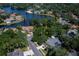 Aerial view of a neighborhood with mature trees and a lake, showcasing the community's serene setting at 4819 Shoreline Cir, Sanford, FL 32771