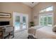 Bedroom with a desk, French doors to pool and vaulted ceilings at 4819 Shoreline Cir, Sanford, FL 32771