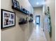 Hallway with pictures and a view to a bedroom and bathroom at 4819 Shoreline Cir, Sanford, FL 32771