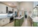 Spacious kitchen boasts an island, stainless steel appliances, white countertops, and bright, modern design at 4819 Shoreline Cir, Sanford, FL 32771