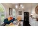 Cozy living room with plush seating, modern lighting, and a stylish wine fridge at 4819 Shoreline Cir, Sanford, FL 32771