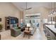 Bright and spacious living room featuring high ceilings, tile floors, and an open concept design at 4819 Shoreline Cir, Sanford, FL 32771
