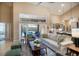 Bright and airy living room featuring high ceilings, stylish decor, and seamless access to the outdoor pool area at 4819 Shoreline Cir, Sanford, FL 32771