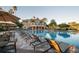 Beautiful pool and clubhouse with lounge chairs for relaxing at 4819 Shoreline Cir, Sanford, FL 32771