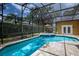 Sparkling pool and spa with screened enclosure and serene backyard setting at 4819 Shoreline Cir, Sanford, FL 32771