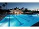 Outdoor pool with lighting at dusk, great for a refreshing evening swim at 4819 Shoreline Cir, Sanford, FL 32771