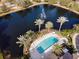 Aerial view showcasing a pool, spa, palm trees, and fountain in a picturesque community setting at 4833 Cypress Woods Dr # 4101, Orlando, FL 32811