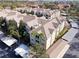 An aerial view of the residential buildings, the carports, and the surrounding landscaping at 4833 Cypress Woods Dr # 4101, Orlando, FL 32811
