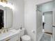 Bathroom featuring a modern vanity, toilet, and shower with gold hardware at 4833 Cypress Woods Dr # 4101, Orlando, FL 32811