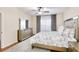 Inviting bedroom features an elegant dresser, ceiling fan and a beautifully styled queen-sized bed at 4833 Cypress Woods Dr # 4101, Orlando, FL 32811