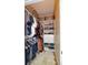 Organized walk-in closet with shelves, hanging rods, and storage baskets at 4833 Cypress Woods Dr # 4101, Orlando, FL 32811