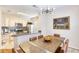 Open-concept kitchen and dining area with stainless appliances and granite countertops and seating at 4833 Cypress Woods Dr # 4101, Orlando, FL 32811