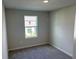 This bedroom has carpet flooring, neutral walls and a window with natural light at 5099 Prairie Preserve Run, St Cloud, FL 34772