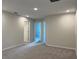 This bedroom has multiple interior doors, carpet, and neutral walls at 5099 Prairie Preserve Run, St Cloud, FL 34772