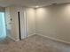 This bedroom has neutral walls, carpet, an interior door, and a closet at 5099 Prairie Preserve Run, St Cloud, FL 34772