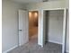 This bedroom has neutral decor, carpet, an interior door, and a closet at 5099 Prairie Preserve Run, St Cloud, FL 34772