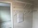 Walk-in closet with wire shelving and rods, providing ample storage space for an organized wardrobe at 5099 Prairie Preserve Run, St Cloud, FL 34772